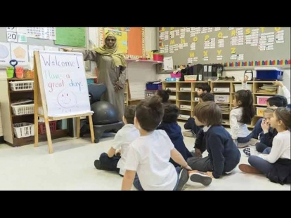 English Montreal School Board (EMSB) teacher Haniyfa Scott gives a lesson to her kindergarten class in April 2019. The EMSB is challenging the CAQ government&#039;s secularism law, which bars newly hired teachers and school administrators from wearing a hijab or any other religious symbol.