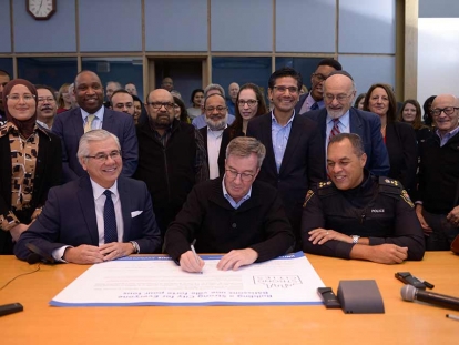 Mayor Jim Watson, Ottawa Police Chief Peter Sloly, and Michael Allen, CEO of United Way East Ontario sign on to United for All Coalition with community partners.