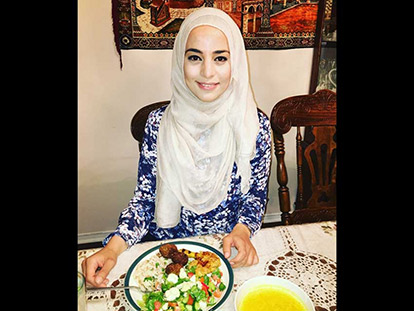 Registered dietitian Rawan Suleiman eating a healthy traditional Palestinian iftar meal.