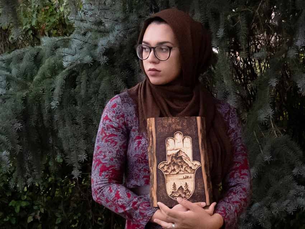Calgary-based artist Aicha Lasfar explores the Canadian Wilderness through the artform of pyrography, the free-hand art of decorating wood using burn marks.