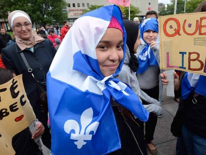 A young girl participates in a demonstration in Montreal organized the day after the Coalition Avenir Québec won the provincial election last October.